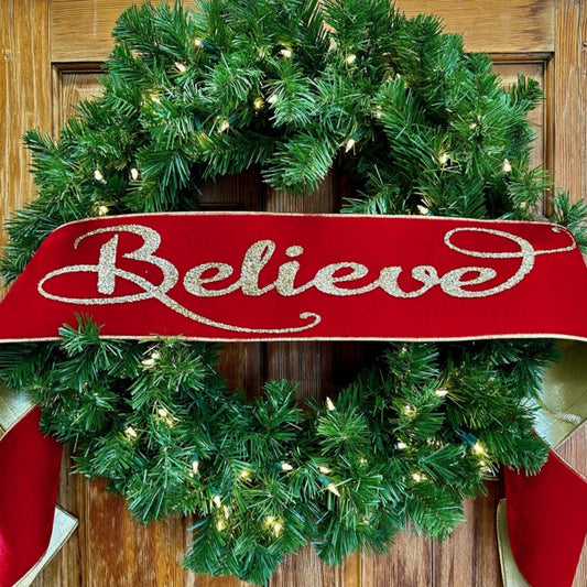 70" velvet gold glitter Believe gold metallic backing on a greenery wreath on a wooden door background