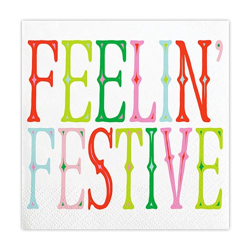 A paper napkin with the text 'Feelin' Festive' written in a colorful, decorative font.
