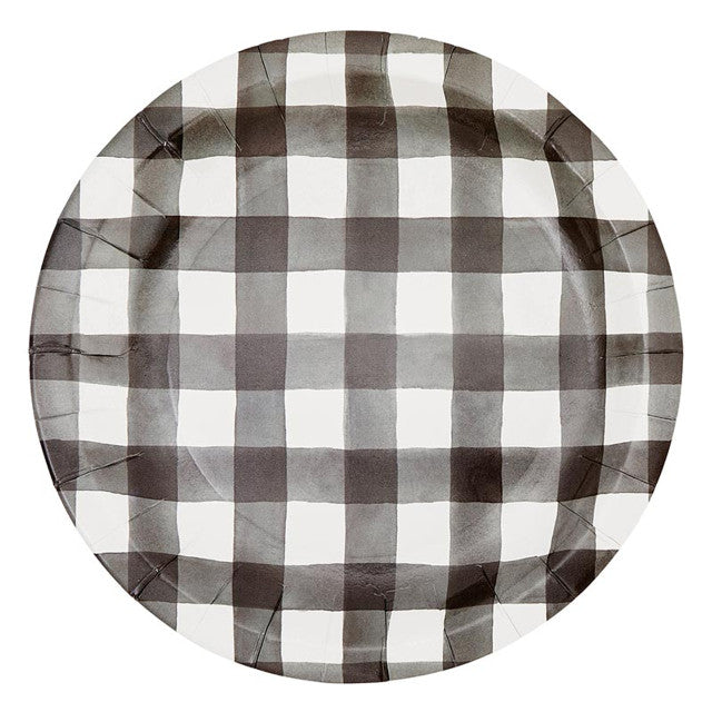 Round paper plate with black and white checkered pattern on a white background