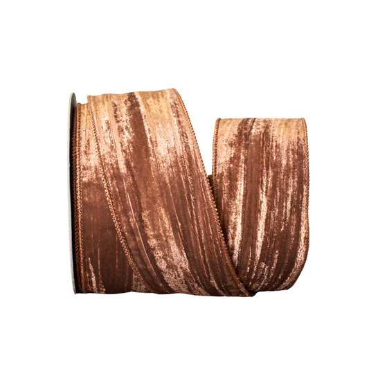 Spool of brown ribbon on a white background