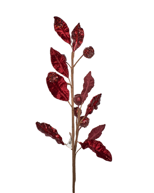Artificial red mini pomegranate branch on a white background
