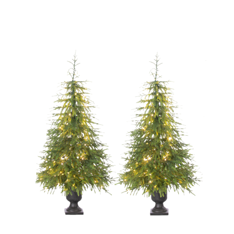 Two artificial Christmas trees with lights on a white background
