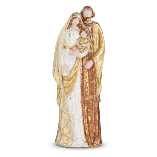 A figurine set depicting the Holy Family, with Mary, Joseph, and baby Jesus, dressed in white and gold.