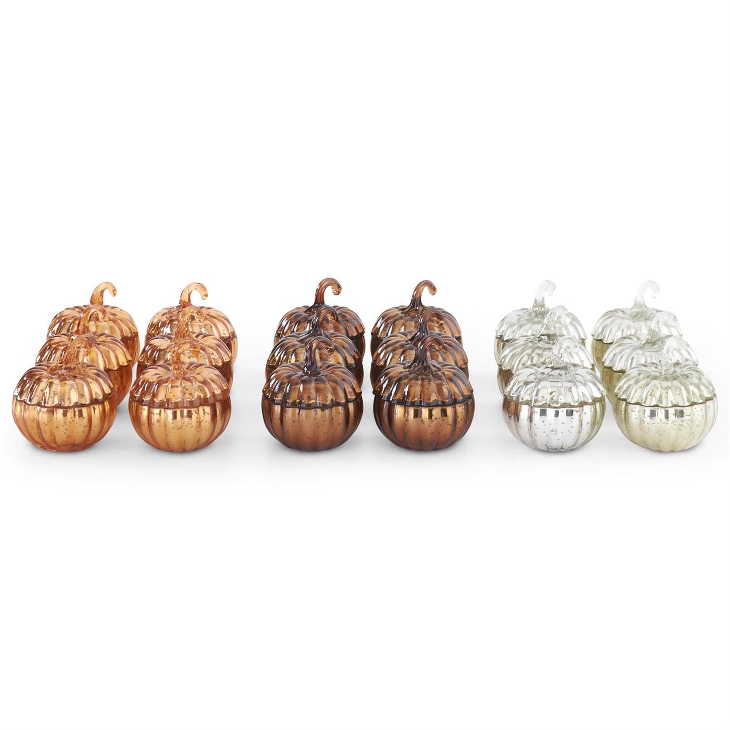 Set of glass pumpkins in brass, green, and silver on a white background