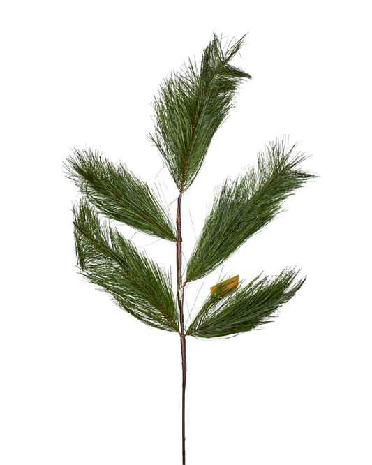 Artificial pine branch with green needles on a white background
