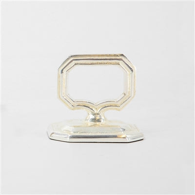 Silver metal card holder on a white background