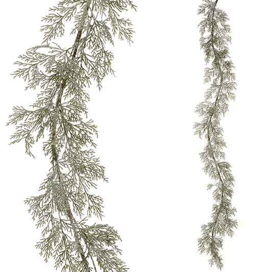 Decorative icy green cedar garland on a white background