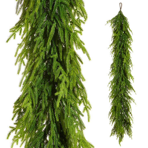 Artificial norfolk pine green garlands hanging against a white background