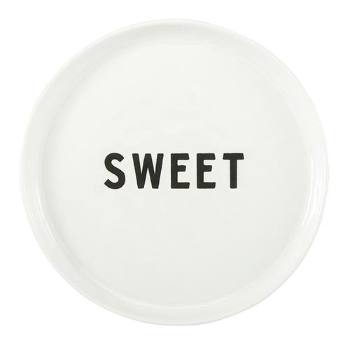 Round white plate with the word 'SWEET' printed on it against a white background