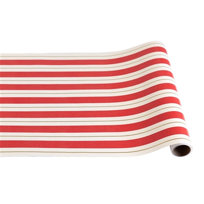 Roll of red and white striped fabric on a white background