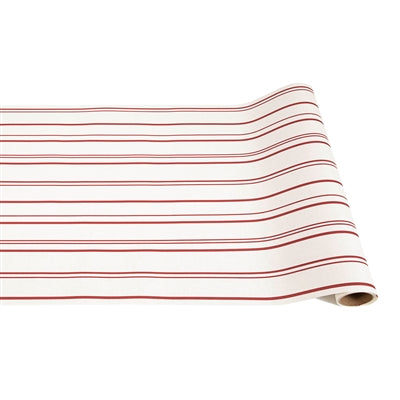 Roll of red and white striped fabric on a white background