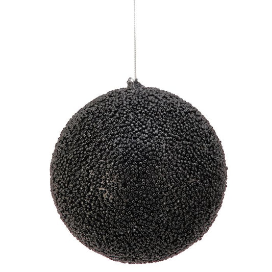 Black beaded ball ornament hanging against a white background