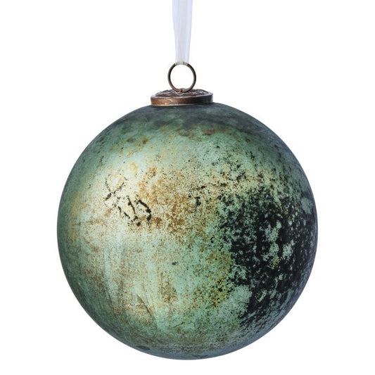 Decorative green ornament with a textured surface on a white background