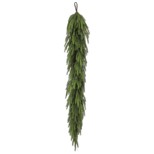 Artificial green garland hanging on a white background