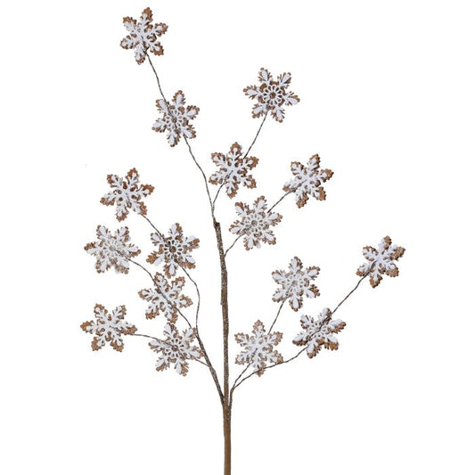 Decorative branch with snowflake-shaped leaves on a white background