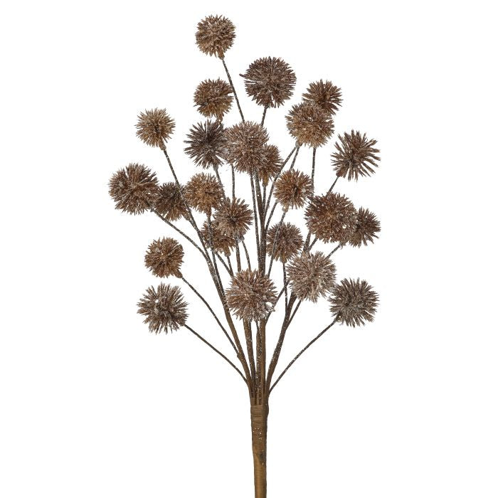 Artificial flower branch with brown spherical flowers on a white background