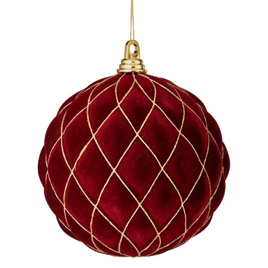 Red velvet Christmas ornament with gold thread on a white background