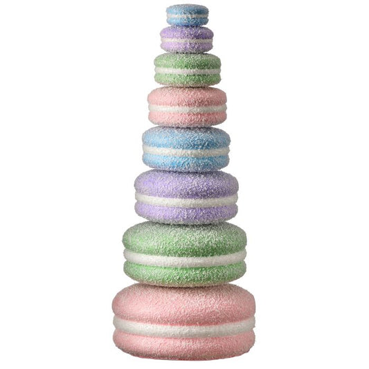 Stack of colorful macaron-shaped decor on a white background