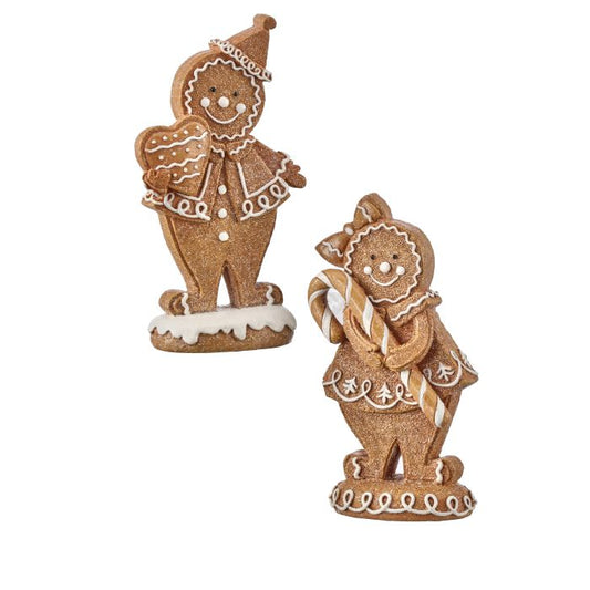 Two gingerbread man figurines on a white background