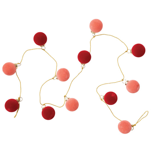 A garland made up of flocked glass balls in pink and red colors with gold-colored clasps and strings.
