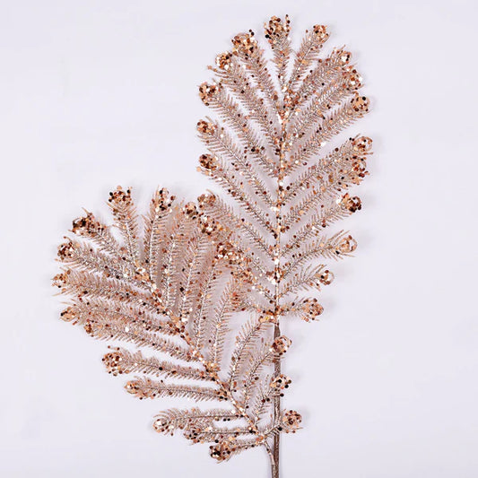 A decorative rose gold Christmas plume with glitter, designed to be used as an embellishment or trim.