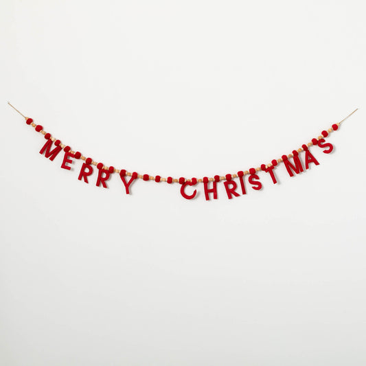 A red and white 'Merry Christmas' garland made of wood and wool, with the text 'Merry Christmas' and small red ornaments strung together on a white background.