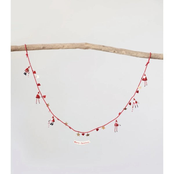A red and white metal garland with Santa Claus figures and the text 'Merry Christmas' displayed.