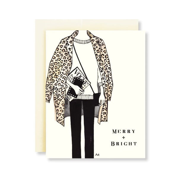 Greeting card featuring a fashion illustration of a person wearing a leopard print jacket with a white sweater, black pants, and carrying a book and a handbag. The card has a white background with 'Merry + Bright' text at the bottom.