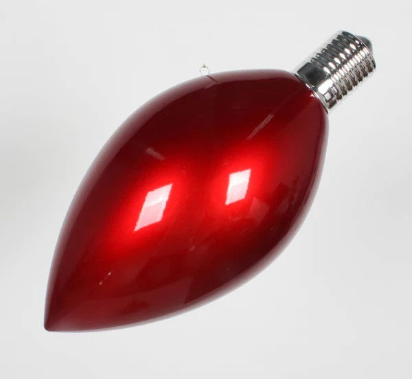 A red light bulb-shaped ornament for Christmas trees.