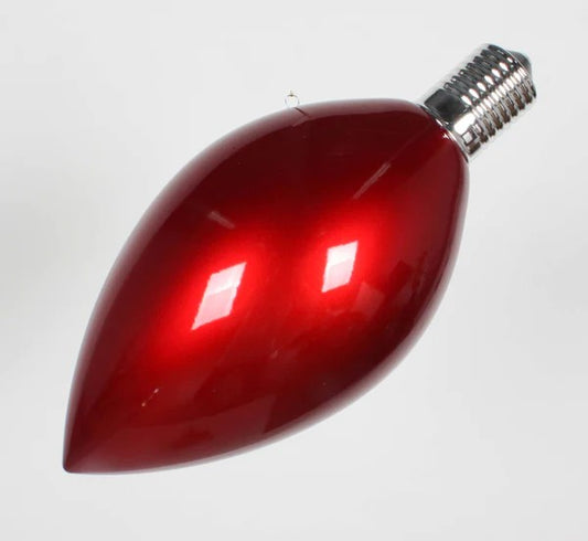 A red light bulb-shaped ornament for Christmas trees.