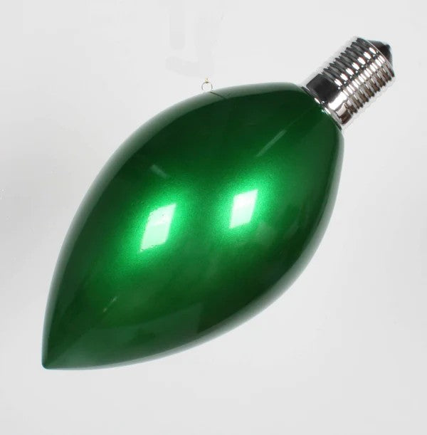 A green light bulb-shaped ornament for Christmas trees.