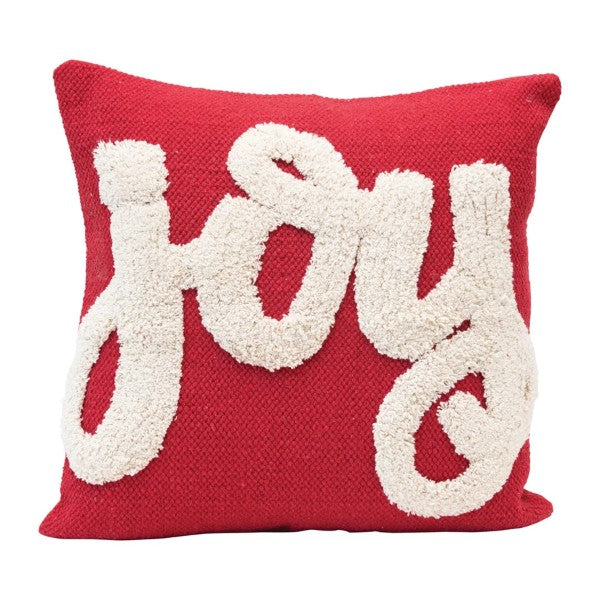 Red and white pillow. Joy written in white tufted cotton on red pillow.