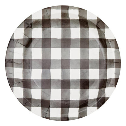Round paper plate with black and white checkered pattern on a white background