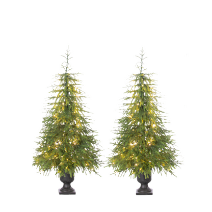 Two artificial Christmas trees with lights on a white background
