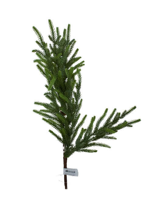 Artificial Christmas tree branch on a white background