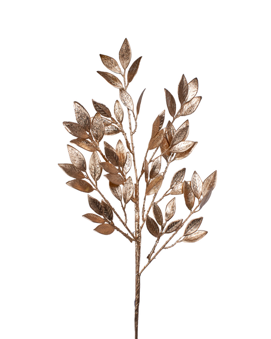Decorative metallic leaf branch on a white background
