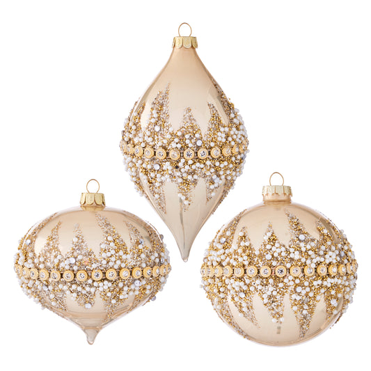 Three decorative Christmas ornaments with gold and pearl patterns on a white background