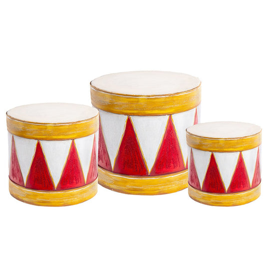 Three decorative Christmas drums with red and white geometric pattern on a white background