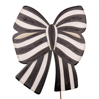 Black and white striped bow-shaped stake on a white background