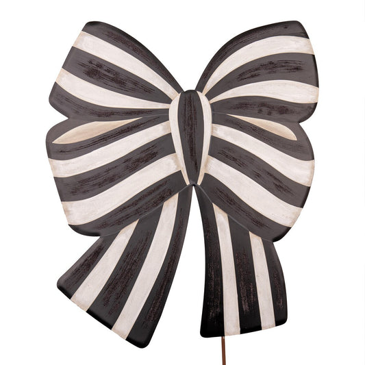 Black and white striped bow-shaped stake on a white background