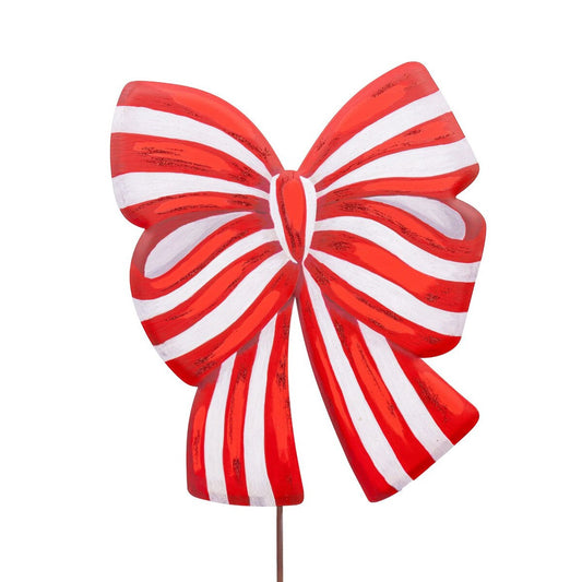 Red and white striped bow-shaped garden stake on a white background