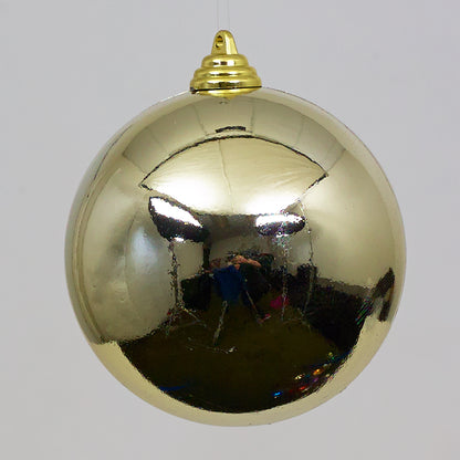 Gold Christmas ball ornament on a white background