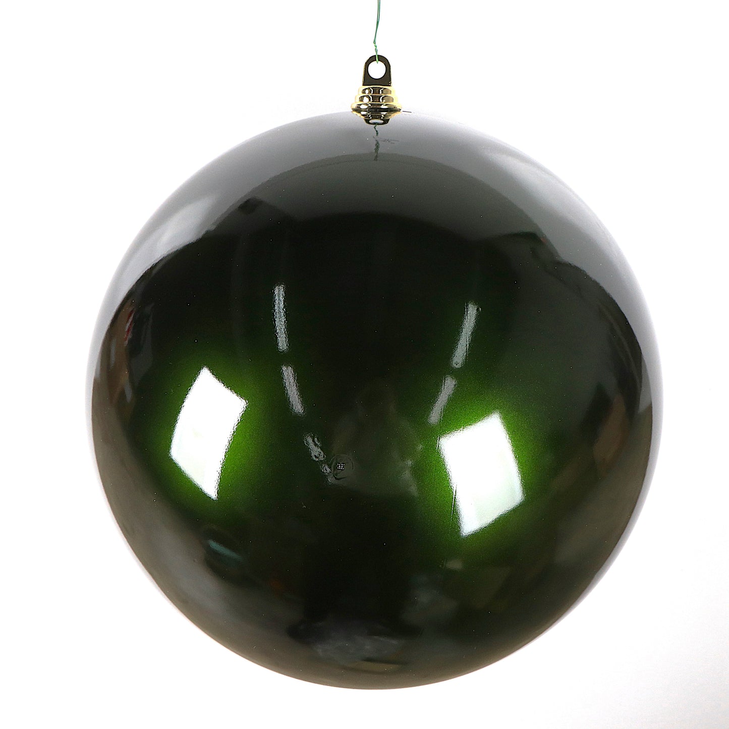 Shiny green Christmas ball ornament on a white background