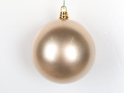 Champagne Christmas ornament on a white background