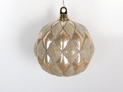 Decorative Christmas ball with diamond pattern on a white background