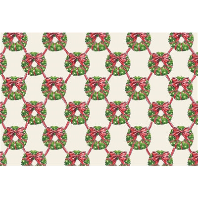 Pattern of green wreaths with red ribbons on a white background