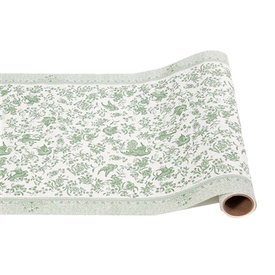 Roll of wallpaper with green floral pattern on a white background