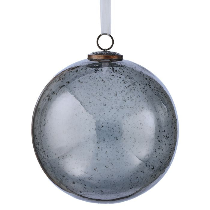 Decorative glass ball with textured surface and hanging ring on a white background