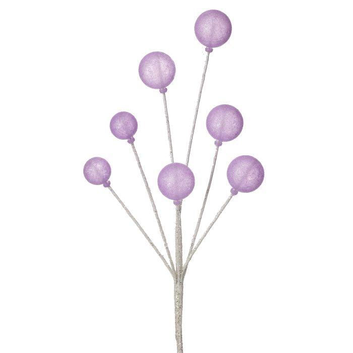 Decorative branch with purple spherical ornaments on a white background