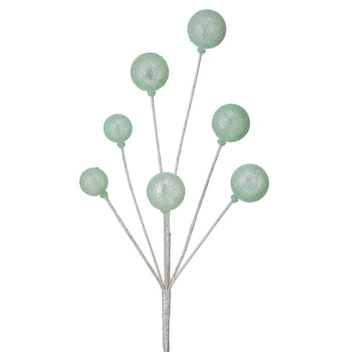 Decorative stem with green spherical beads on a white background